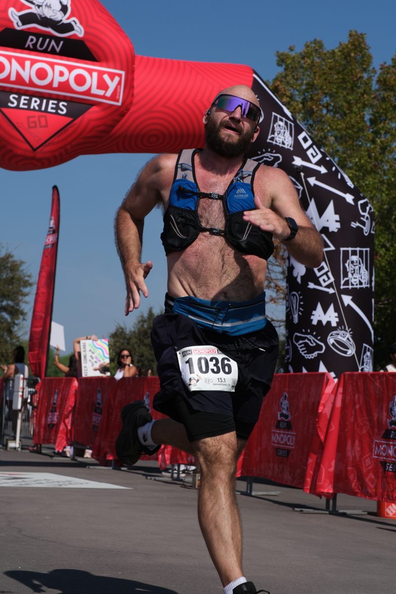 Sprinting toward the finish line under the Monopoly arch